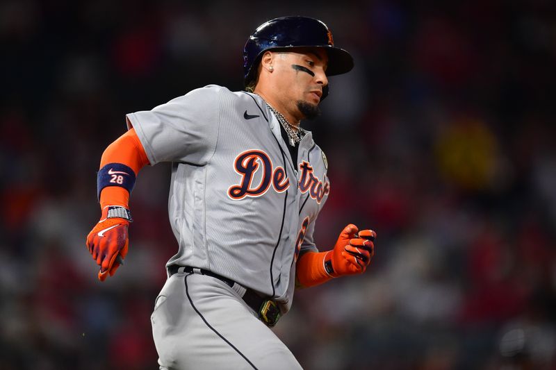 Sep 15, 2023; Anaheim, California, USA; Detroit Tigers shortstop Javier Baez (28) runs after hitting a three run RBI double against the Los Angeles Angels during the ninth inning at Angel Stadium. Mandatory Credit: Gary A. Vasquez-USA TODAY Sports