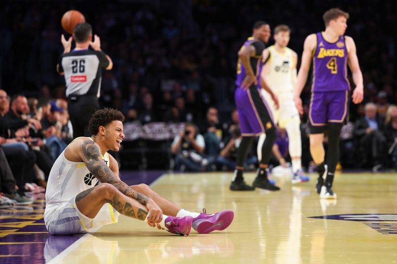 LOS ANGELES, CALIFORNIA - NOVEMBER 19: Keyonte George #3 of the Utah Jazz reacts after falling to the ground while playing the Los Angeles Lakers during the first quarter of the Emirates NBA Cup at Crypto.com Arena on November 19, 2024 in Los Angeles, California. NOTE TO USER: User expressly acknowledges and agrees that, by downloading and or using this photograph, User is consenting to the terms and conditions of the Getty Images License Agreement.  (Photo by Harry How/Getty Images)