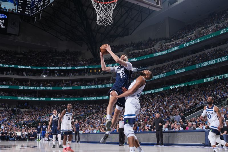 DALLAS, TX - MAY 28: Maxi Kleber #42 of the Dallas Mavericks drives to the basket during the game against the Minnesota Timberwolves during Game 3 of the Western Conference Finals of the 2024 NBA Playoffs on May 28, 2024 at the American Airlines Center in Dallas, Texas. NOTE TO USER: User expressly acknowledges and agrees that, by downloading and or using this photograph, User is consenting to the terms and conditions of the Getty Images License Agreement. Mandatory Copyright Notice: Copyright 2024 NBAE (Photo by Jesse D. Garrabrant/NBAE via Getty Images)