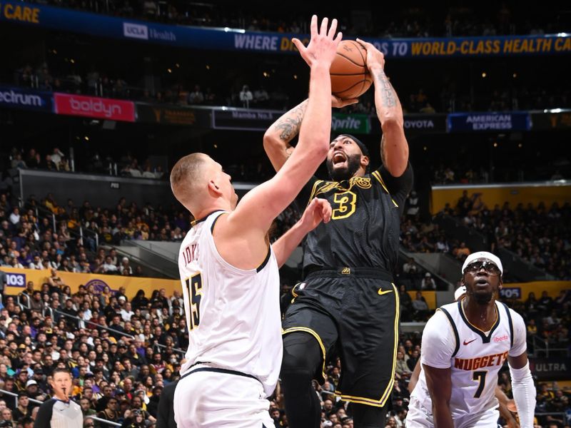 LOS ANGELES, CA - FEBRUARY 8: Anthony Davis #3 of the Los Angeles Lakers drives to the basket during the game against the Denver Nuggets on Feburary 8, 2024 at Crypto.Com Arena in Los Angeles, California. NOTE TO USER: User expressly acknowledges and agrees that, by downloading and/or using this Photograph, user is consenting to the terms and conditions of the Getty Images License Agreement. Mandatory Copyright Notice: Copyright 2024 NBAE (Photo by Andrew D. Bernstein/NBAE via Getty Images)