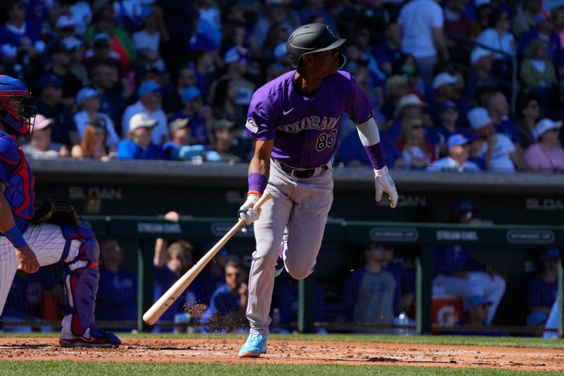 Feb 29, 2024; Mesa, Arizona, USA; Colorado Rockies third baseman Julio Carreras (83) hits a three run home run against the Chicago Cubs in the second inning at Sloan Park. Mandatory Credit: Rick Scuteri-USA TODAY Sports