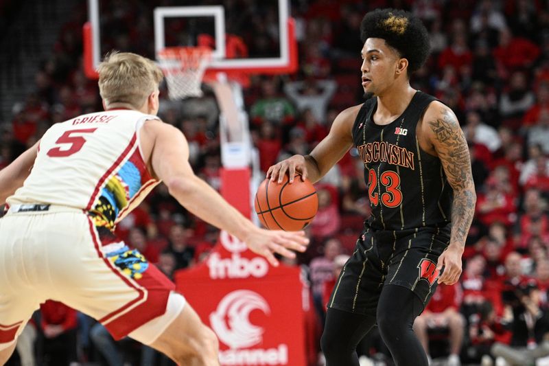 Feb 11, 2023; Lincoln, Nebraska, USA;  Wisconsin Badgers guard Chucky Hepburn (23) dribbles against Nebraska Cornhuskers guard Sam Griesel (5) in the second half at Pinnacle Bank Arena. Mandatory Credit: Steven Branscombe-USA TODAY Sports