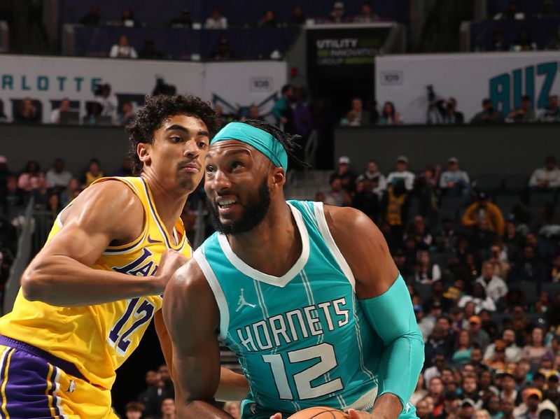 CHARLOTTE, NC - JANUARY 27:  Josh Okogie #12 of the Charlotte Hornets drives to the basket during the game against the Los Angeles Lakers on January 27, 2025 at Spectrum Center in Charlotte, North Carolina. NOTE TO USER: User expressly acknowledges and agrees that, by downloading and or using this photograph, User is consenting to the terms and conditions of the Getty Images License Agreement. Mandatory Copyright Notice: Copyright 2025 NBAE (Photo by Kent Smith/NBAE via Getty Images)