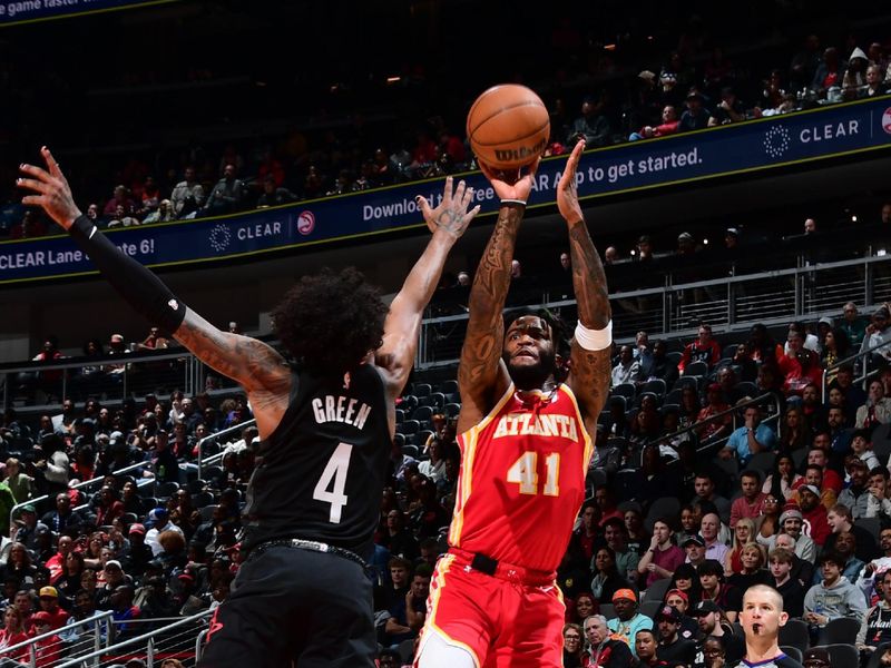 ATLANTA, GA - FEBRUARY 10: Saddiq Bey #41 of the Atlanta Hawks shoots the ball during the game against the Houston Rockets on February 10, 2024 at State Farm Arena in Atlanta, Georgia.  NOTE TO USER: User expressly acknowledges and agrees that, by downloading and/or using this Photograph, user is consenting to the terms and conditions of the Getty Images License Agreement. Mandatory Copyright Notice: Copyright 2024 NBAE (Photo by Scott Cunningham/NBAE via Getty Images)