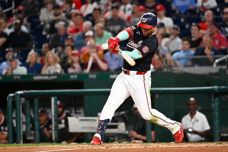 Sep 15, 2025; Washington, District of Columbia, USA; Washington Nationals second baseman Luis Garcia Jr. (2) singles against the Atlanta Braves during the fourth inning at Nationals Park. Mandatory Credit: Brad Mills-Imagn Images