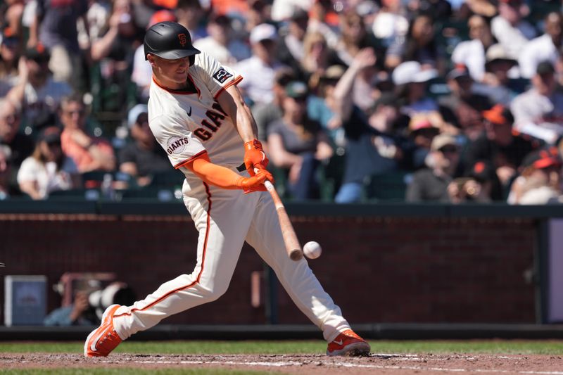 Apr 20, 2024; San Francisco, California, USA; San Francisco Giants third base Matt Chapman (26) hits a single against the Arizona Diamondbacks during the sixth inning at Oracle Park. Mandatory Credit: Darren Yamashita-USA TODAY Sports