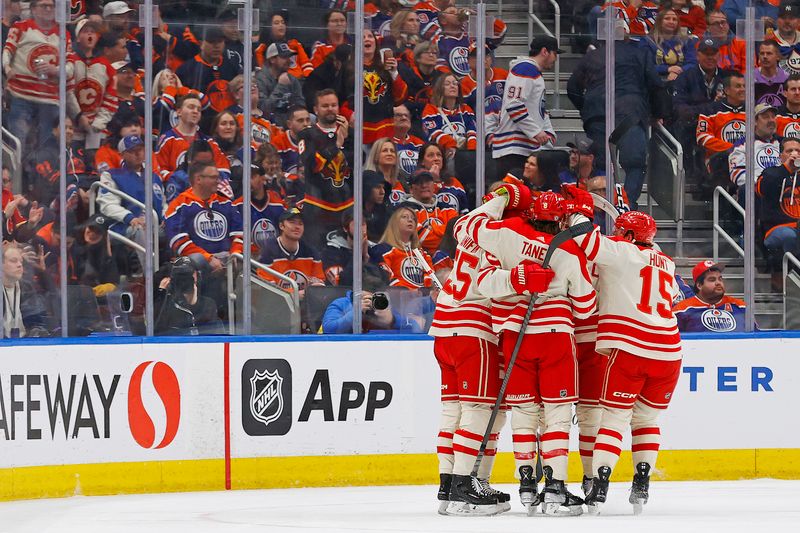 Feb 24, 2024; Edmonton, Alberta, CAN; The Calgary Flames celebrate a goal scored by defensemen Noah Hanifin (55) during the first period against the Edmonton Oilers at Rogers Place. Mandatory Credit: Perry Nelson-USA TODAY Sports