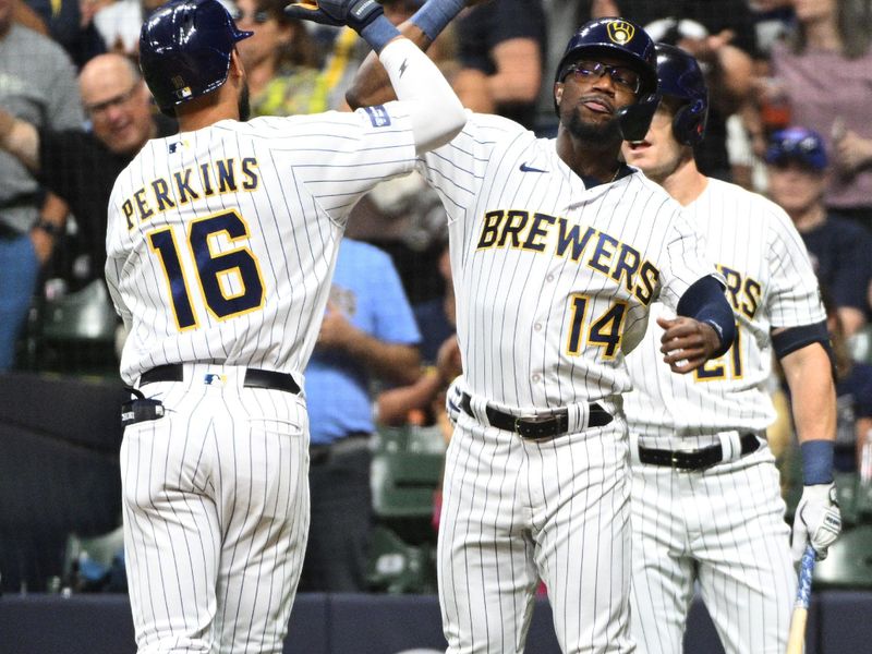 Sep 30, 2023; Milwaukee, Wisconsin, USA; Milwaukee Brewers second baseman Andruw Monasterio (14) congratulates Milwaukee Brewers right fielder Blake Perkins (16) after hitting a home run against the Chicago Cubs in the second inning at American Family Field. Mandatory Credit: Michael McLoone-USA TODAY Sports