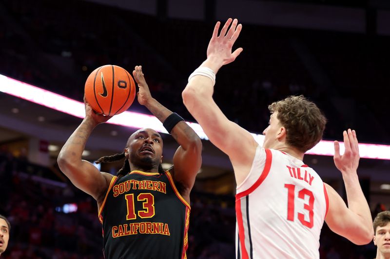 Feb 11, 2026; Columbus, Ohio, USA;  USC Trojans guard Kam Woods (13) goes to the basket as Ohio State Buckeyes center Christoph Tilly (13) defends during the first half at Value City Arena. Mandatory Credit: Joseph Maiorana-Imagn Images
