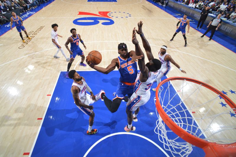 PHILADELPHIA, PA - JANUARY 15: Precious Achiuwa #5 of the New York Knicks drives to the basket during the game against the Philadelphia 76ers on January 15, 2025 at the Wells Fargo Center in Philadelphia, Pennsylvania NOTE TO USER: User expressly acknowledges and agrees that, by downloading and/or using this Photograph, user is consenting to the terms and conditions of the Getty Images License Agreement. Mandatory Copyright Notice: Copyright 2025 NBAE (Photo by Jesse D. Garrabrant/NBAE via Getty Images)