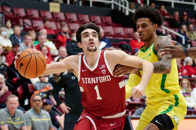 Jan 21, 2023; Stanford, California, USA; Stanford Cardinal guard Isa Silva (1) drives to the basket against Oregon Ducks guard Rivaldo Soares (11) during the first half at Maples Pavilion. Mandatory Credit: Robert Edwards-USA TODAY Sports