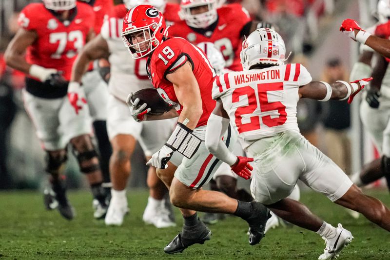 Nov 11, 2023; Athens, Georgia, USA; Georgia Bulldogs tight end Brock Bowers (19) runs after a catch in front of Mississippi Rebels safety Trey Washington (25) during the first half at Sanford Stadium. Mandatory Credit: Dale Zanine-USA TODAY Sports