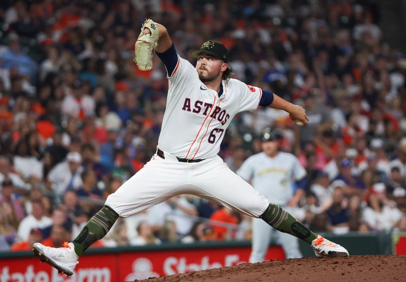 May 18, 2024; Houston, Texas, USA; Houston Astros relief pitcher Parker Mushinski (67) pitches against the Milwaukee Brewers in the eighth inning at Minute Maid Park. Mandatory Credit: Thomas Shea-USA TODAY Sports