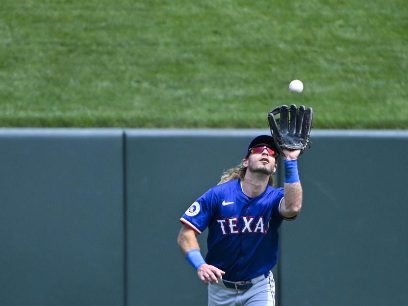 Jul 31, 2024; St. Louis, Missouri, USA;  Texas Rangers center fielder Travis Jankowski (16) catches a fly ball against the St. Louis Cardinals during the third inning at Busch Stadium. Mandatory Credit: Jeff Curry-USA TODAY Sports