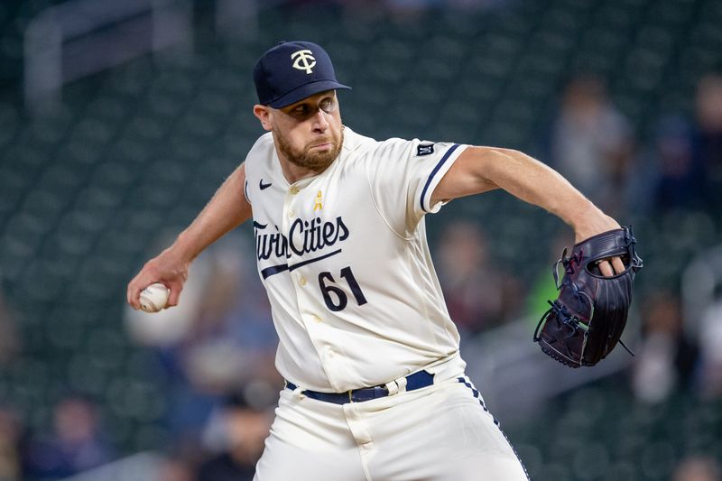 Sep 26, 2023; Minneapolis, Minnesota, USA; Minnesota Twins relief pitcher Brock Stewart (61) delivers a pitch against the Oakland Athletics in the ninth inning at Target Field. Mandatory Credit: Jesse Johnson-USA TODAY Sports