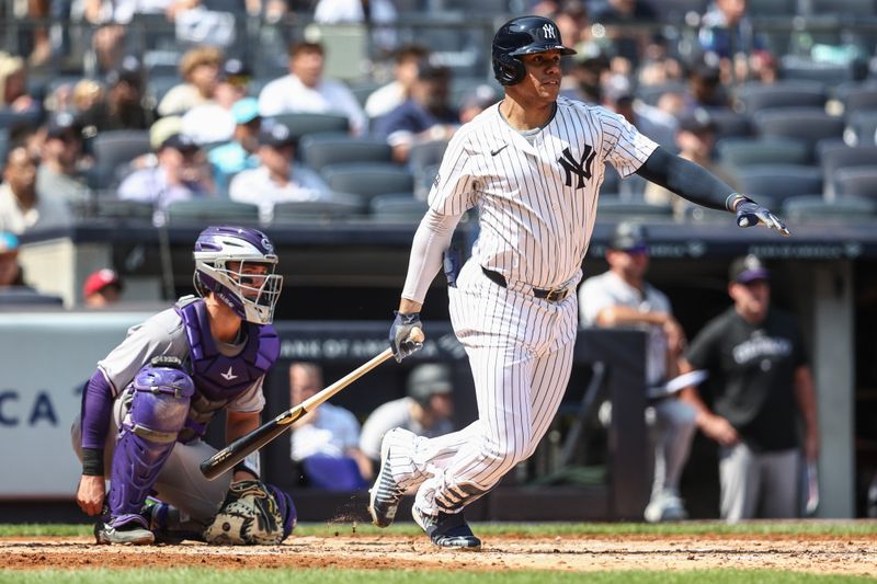 Aug 25, 2024; Bronx, New York, USA;  New York Yankees right fielder Juan Soto (22) hits an RBI single in the second inning against the Colorado Rockies at Yankee Stadium. Mandatory Credit: Wendell Cruz-USA TODAY Sports