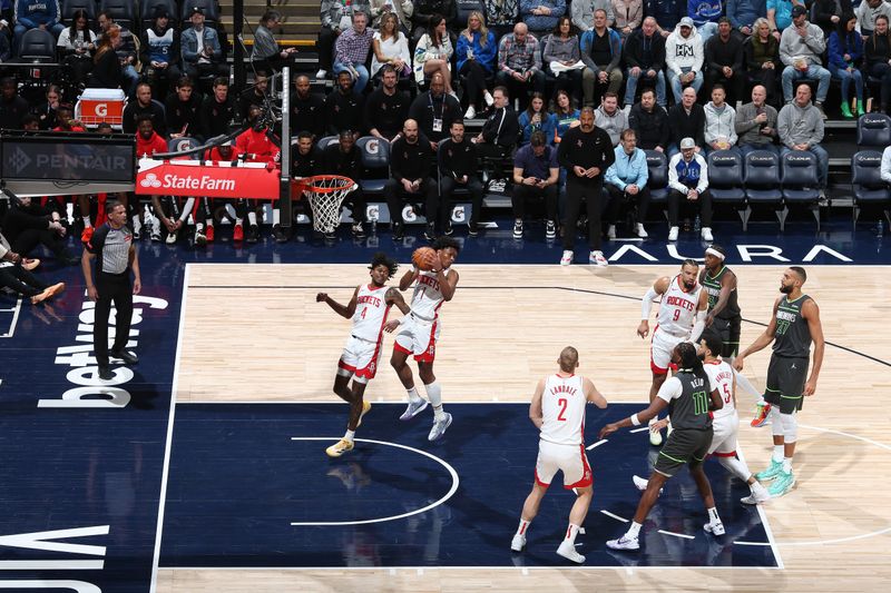 MINNEAPOLIS, MN -  APRIL 2:  Amen Thompson #1 of the Houston Rockets grabs a rebound during the game against the Minnesota Timberwolves on April 2, 2024 at Target Center in Minneapolis, Minnesota. NOTE TO USER: User expressly acknowledges and agrees that, by downloading and or using this Photograph, user is consenting to the terms and conditions of the Getty Images License Agreement. Mandatory Copyright Notice: Copyright 2024 NBAE (Photo by David Sherman/NBAE via Getty Images)