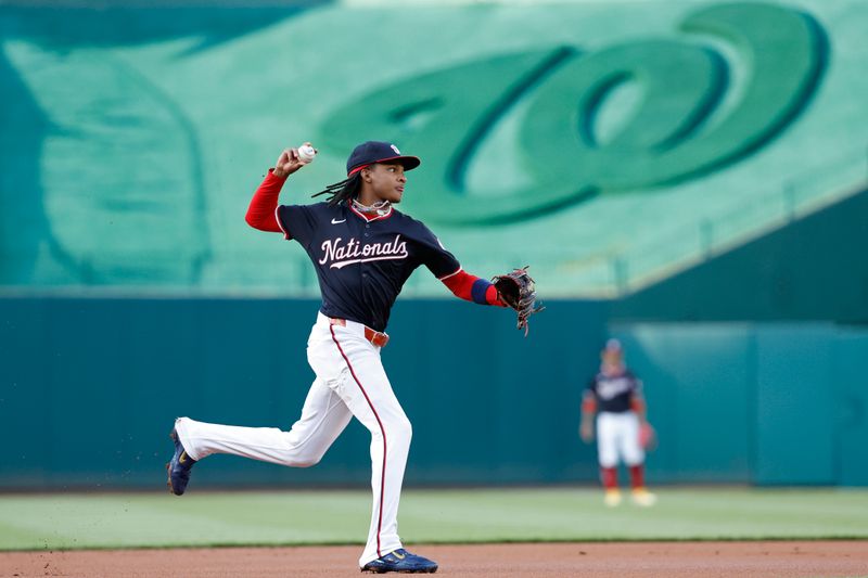 Apr 24, 2024; Washington, District of Columbia, USA; Washington Nationals shortstop CJ Abrams (5) makes a throw to first base on a ground ball hit by Los Angeles Dodgers shortstop Mookie Betts (not pictured) during the first inning at Nationals Park. Mandatory Credit: Geoff Burke-USA TODAY Sports