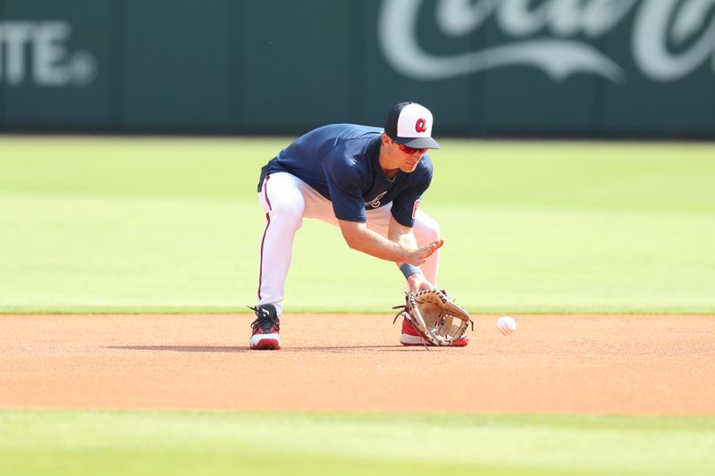 Apr 20, 2024; Cumberland, Georgia, USA; Atlanta Braves shortstop Luke Williams (65) fields the ball before a game against the Texas Rangers at Truist Park. Mandatory Credit: Mady Mertens-USA TODAY Sports