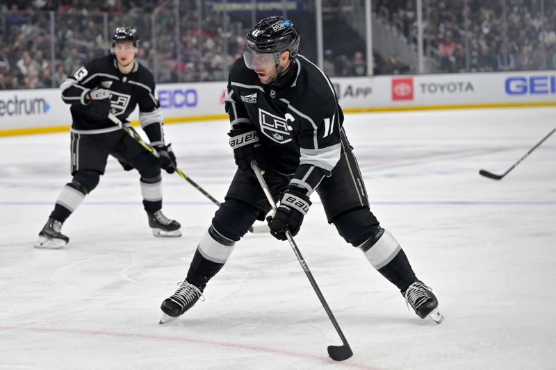 Mar 3, 2024; Los Angeles, California, USA; Los Angeles Kings center Anze Kopitar (11) takes a shot on goal in the second period against the New Jersey Devils at Crypto.com Arena. Mandatory Credit: Jayne Kamin-Oncea-USA TODAY Sports