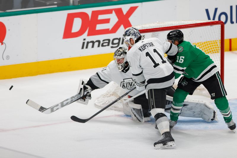 Mar 16, 2024; Dallas, Texas, USA; Los Angeles Kings goaltender David Rittich (31) fights off a shot with center Anze Kopitar (11) and Dallas Stars center Joe Pavelski (16) in front of his goal during the first period at American Airlines Center. Mandatory Credit: Andrew Dieb-USA TODAY Sports