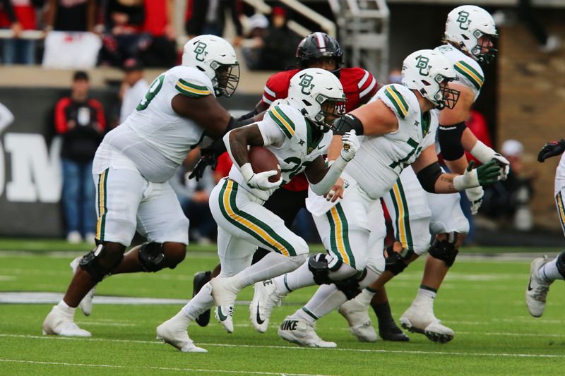 Oct 19, 2024; Lubbock, Texas, USA;  Baylor Bears running back Richard Reese (29) runs the ball against the Texas Tech Red Raiders in the second half at Jones AT&T Stadium and Cody Campbell Field. Mandatory Credit: Michael C. Johnson-Imagn Images