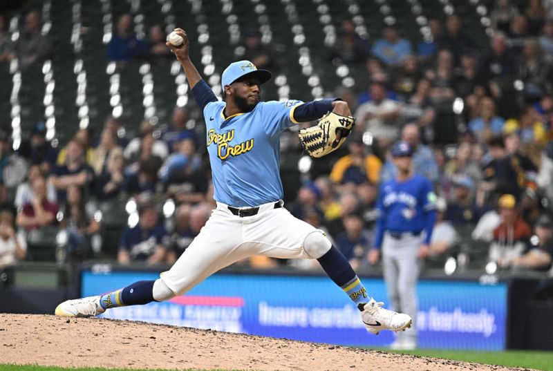 Jun 11, 2024; Milwaukee, Wisconsin, USA; Milwaukee Brewers relief pitcher Enoli Paredes (49) delivers a pitch in the eighth inning against the Toronto Blue Jays at American Family Field. Mandatory Credit: Michael McLoone-USA TODAY Sports