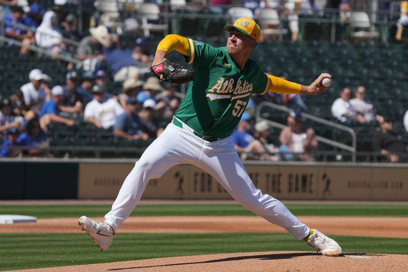 Mar 8, 2026; Mesa, Arizona, USA; Athletics pitcher Jacob Lopez (57) throws against the Los Angeles Dodgers in the first inning at Hohokam Stadium. Mandatory Credit: Rick Scuteri-Imagn Images