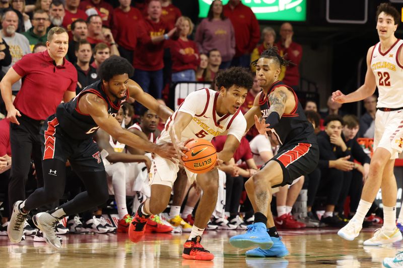 Feb 17, 2024; Ames, Iowa, USA; Iowa State Cyclones guard Curtis Jones (5) controls the ball against Texas Tech Red Raiders guard Chance McMillian (0) and guard Pop Isaacs (2) during the second half at James H. Hilton Coliseum. Mandatory Credit: Reese Strickland-USA TODAY Sports