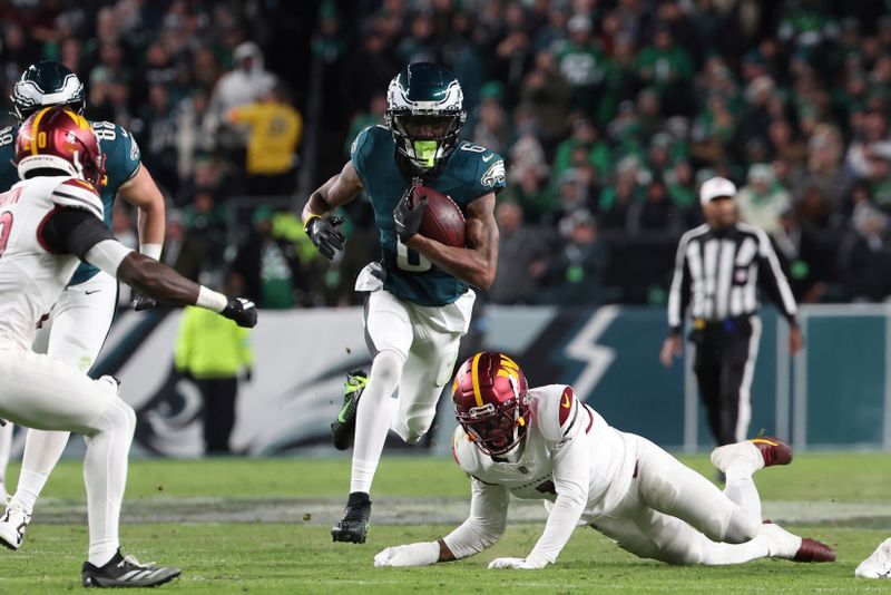 Philadelphia Eagles wide receiver DeVonta Smith (6) runs after a catch during an NFL football game against the Washington Commanders, Thursday, Nov. 14, 2024, in Philadelphia, PA. (AP Photo/Peter Joneleit)