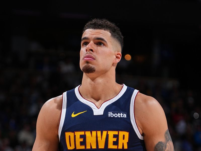 DENVER, CO - APRIL 10: Michael Porter Jr. #1 of the Denver Nuggets shoots a free throw during the game against the Minnesota Timberwolves on April 10, 2024 at the Ball Arena in Denver, Colorado. NOTE TO USER: User expressly acknowledges and agrees that, by downloading and/or using this Photograph, user is consenting to the terms and conditions of the Getty Images License Agreement. Mandatory Copyright Notice: Copyright 2024 NBAE (Photo by Garrett Ellwood/NBAE via Getty Images)