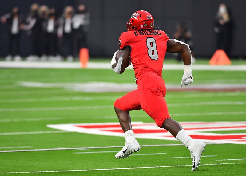 Oct 16, 2021; Paradise, Nevada, USA; UNLV Rebels running back Charles Williams (8) runs across open field to score a  touchdown at Allegiant Stadium. Mandatory Credit: Stephen R. Sylvanie-USA TODAY Sports