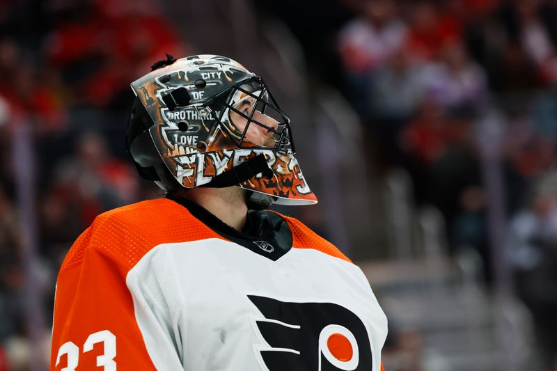 Jan 25, 2024; Detroit, Michigan, USA;  Philadelphia Flyers goaltender Samuel Ersson (33) looks up at the score board in the second period against the Detroit Red Wings at Little Caesars Arena. Mandatory Credit: Rick Osentoski-USA TODAY Sports