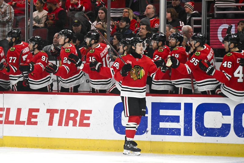 Jan 3, 2025; Chicago, Illinois, USA;  Chicago Blackhawks left wing Tyler Bertuzzi (59) celebrates his goal against the Montreal Canadiens during the first period at United Center. Mandatory Credit: Matt Marton-Imagn Images