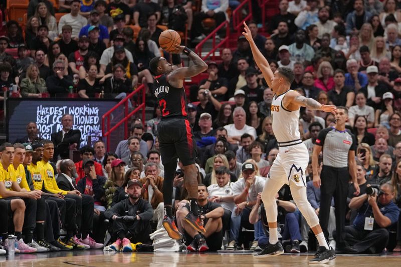 MIAMI, FL - MARCH 13: Terry Rozier #2 of the Miami Heat shoots the ball during the game against the Denver Nuggets on March 13, 2024 at Kaseya Center in Miami, Florida. NOTE TO USER: User expressly acknowledges and agrees that, by downloading and or using this Photograph, user is consenting to the terms and conditions of the Getty Images License Agreement. Mandatory Copyright Notice: Copyright 2024 NBAE (Photo by Eric Espada/NBAE via Getty Images)