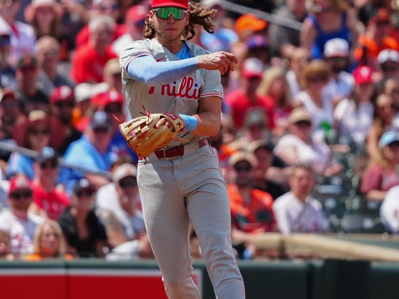 Jun 16, 2024; Baltimore, Maryland, USA; Philadelphia Phillies third baseman Alec Bohm (28) throws out Baltimore Orioles second baseman Jordan Westburg (not pictured) after fielding a ground ball during the third inning at Oriole Park at Camden Yards. Mandatory Credit: Gregory Fisher-USA TODAY Sports