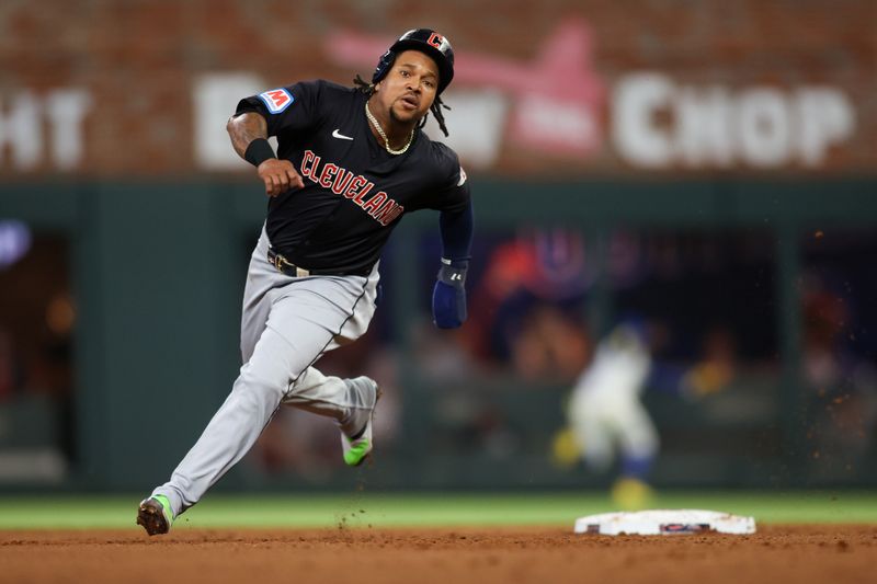 Apr 27, 2024; Atlanta, Georgia, USA; Cleveland Guardians third baseman Jose Ramirez (11) runs to third against the Atlanta Braves in the sixth inning at Truist Park. Mandatory Credit: Brett Davis-USA TODAY Sports