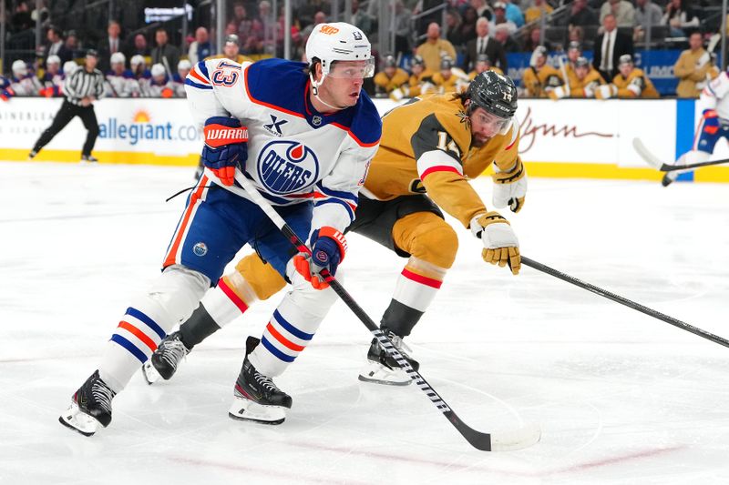 Dec 3, 2024; Las Vegas, Nevada, USA; Edmonton Oilers center Mattias Janmark (13) skates against Vegas Golden Knights defenseman Nicolas Hague (14) during the first period at T-Mobile Arena. Mandatory Credit: Stephen R. Sylvanie-Imagn Images