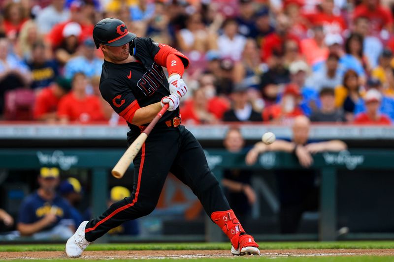 Aug 30, 2024; Cincinnati, Ohio, USA; Cincinnati Reds first baseman Ty France (2) hits a single in the second inning against the Milwaukee Brewers at Great American Ball Park. Mandatory Credit: Katie Stratman-USA TODAY Sports