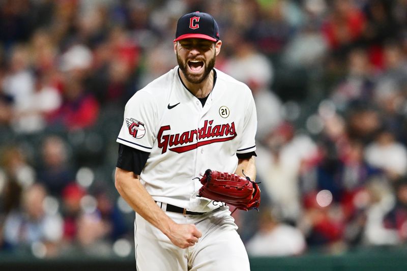 Sep 15, 2023; Cleveland, Ohio, USA; Cleveland Guardians starting pitcher Lucas Giolito (27) reacts after striking out Texas Rangers right fielder Robbie Grossman (not pictured) during the seventh inning at Progressive Field. Mandatory Credit: Ken Blaze-USA TODAY Sports