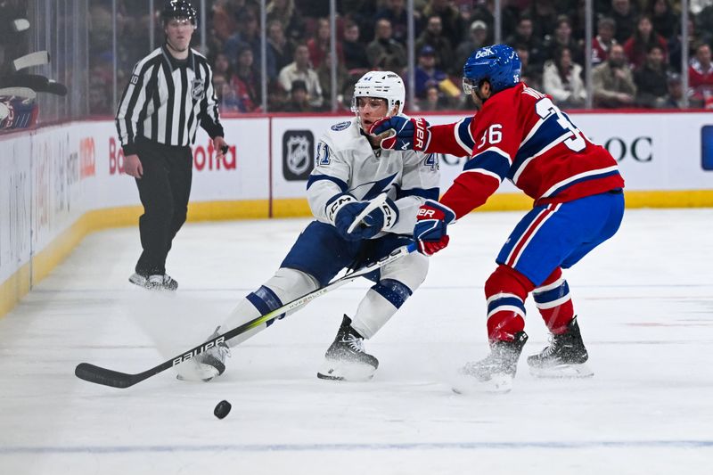 Apr 4, 2024; Montreal, Quebec, CAN; Montreal Canadiens center Colin White (36) defends against Tampa Bay Lightning right wing Mitchell Chaffee (41) during the second period at Bell Centre. Mandatory Credit: David Kirouac-USA TODAY Sports