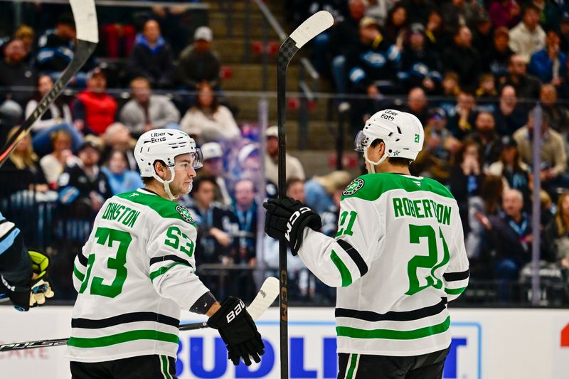 Jan 31, 2026; Salt Lake City, Utah, USA; Dallas Stars center Wyatt Johnston (53) and left wing Jason Robertson (21) celebrate after a goal during first period against the Utah Mammoth at Delta Center. Mandatory Credit: Peter Creveling-Imagn Images