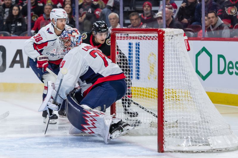 Jan 30, 2025; Ottawa, Ontario, CAN; Washington Capitals goalie Charlie Lindgren (79) follows the puck after making a save on a shot from Ottawa Senators center Ridly Greig (71) in the first period at the Canadian Tire Centre. Mandatory Credit: Marc DesRosiers-Imagn Images