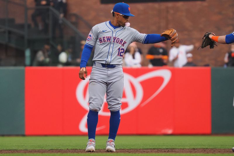 Apr 24, 2024; San Francisco, California, USA; New York Mets shortstop Francisco Lindor (12) gestures after catching a San Francisco Giants runner taking a lead off second base during the third inning at Oracle Park. Mandatory Credit: Kelley L Cox-USA TODAY Sports