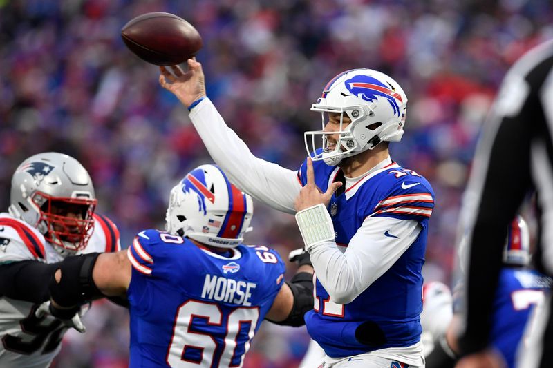 Buffalo Bills quarterback Josh Allen throws a pass during the second half of an NFL football game against the New England Patriots in Orchard Park, N.Y., Sunday, Dec. 31, 2023. (AP Photo/Adrian Kraus)