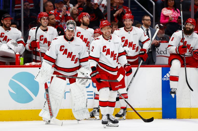 Mar 22, 2024; Washington, District of Columbia, USA; Carolina Hurricanes center Evgeny Kuznetsov (92) smiles after being recognized during the first period against the Washington Capitals at Capital One Arena. Mandatory Credit: Amber Searls-USA TODAY Sports