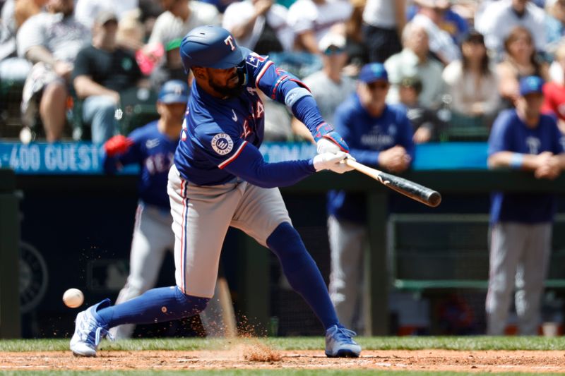 Jun 16, 2024; Seattle, Washington, USA; Texas Rangers right fielder Adolis Garcia (53) strikes out on a check-swing  against the Seattle Mariners during the seventh inning at T-Mobile Park. Mandatory Credit: Joe Nicholson-USA TODAY Sports