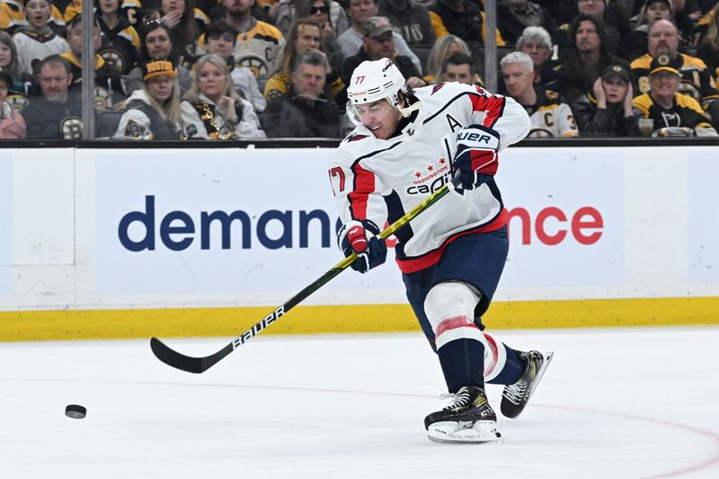 Feb 10, 2024; Boston, Massachusetts, USA; Washington Capitals right wing T.J. Oshie (77) shoots the puck against the Boston Bruins during the second period at the TD Garden. Mandatory Credit: Brian Fluharty-USA TODAY Sports