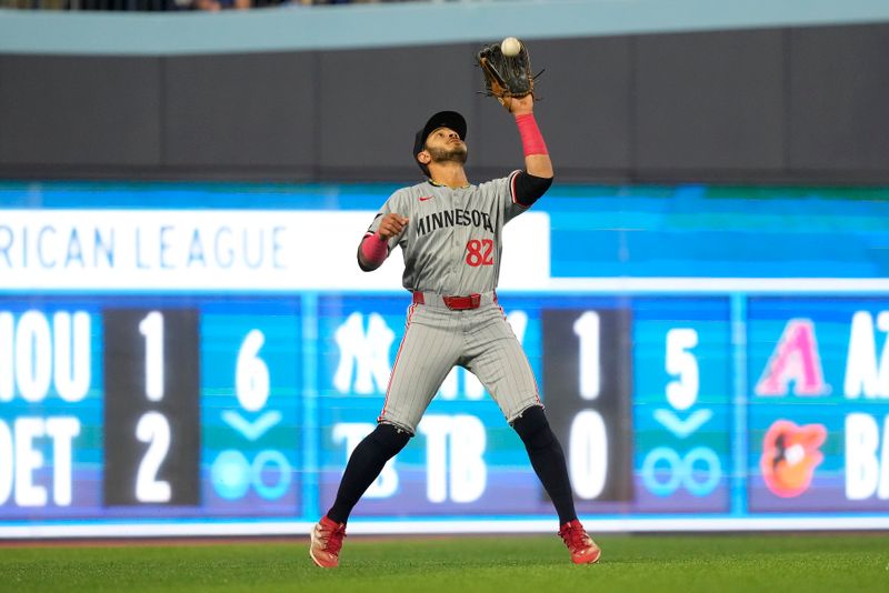 May 10, 2024; Toronto, Ontario, CAN; Minnesota Twins left fielder Austin Martin (82) catches a fly ball hit by Toronto Blue Jays catcher Danny Jansen (not pictured) during the fourth inning at Rogers Centre. Mandatory Credit: John E. Sokolowski-USA TODAY Sports