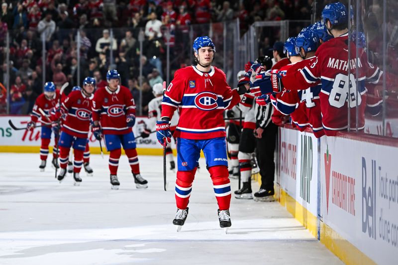 Dec 2, 2025; Montreal, Quebec, CAN; Montreal Canadiens left wing Juraj Slafkovsky (20) celebrates his goal against the Ottawa Senators with his teammates at the bench during the first period at Bell Centre. Mandatory Credit: David Kirouac-Imagn Images